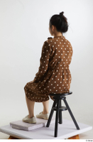    Aera  1 brown dots dress casual dressed sitting white oxford shoes whole body 0002.jpg